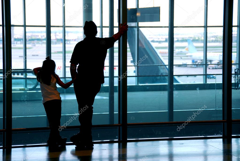 Family waiting at the international airport terminal
