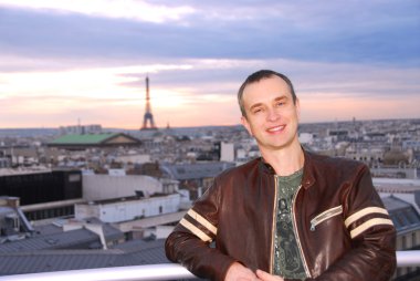 Portrait of a man on background of Paris view clipart