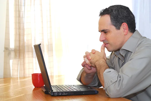 Man Sitting His Desk Laptop Looking Thoughtful — Stock Photo, Image