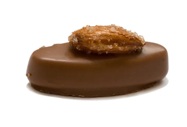 Oval choklad godis till socker muttern — Stockfoto