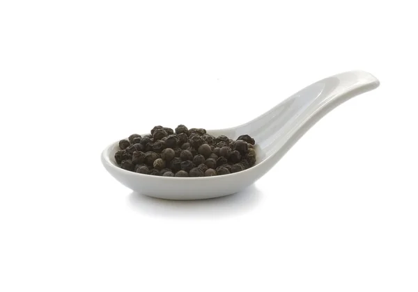 Spoon whit black pepper, isolated — Stock Photo, Image