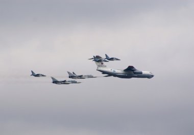 Il-78 escorted by fighters clipart