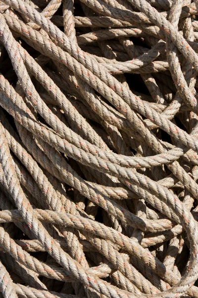 Background image of coiled, used rope Royalty Free Stock Photos
