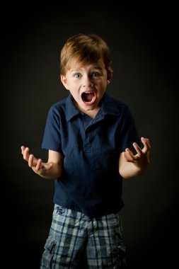 Young boy screaming with emotion clipart