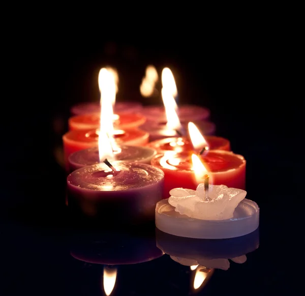 Red, white, purple candles — Stock Photo, Image