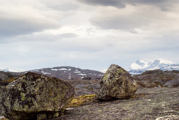 stock image Boulders against mountains