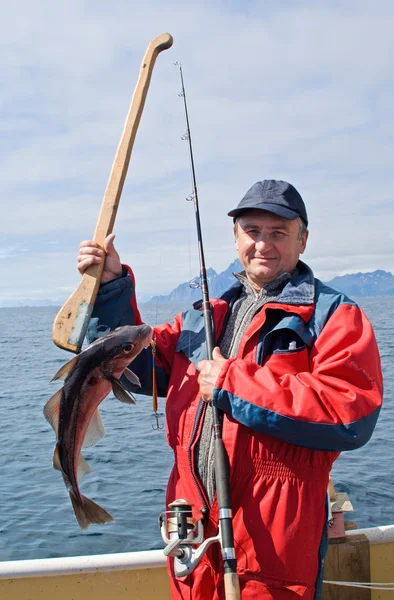 Fiskare med fisk — Stockfoto