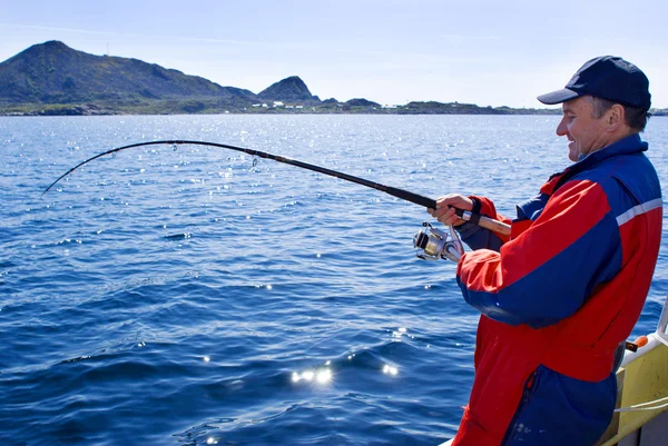 Fisherman with a spinning — Stock Photo, Image