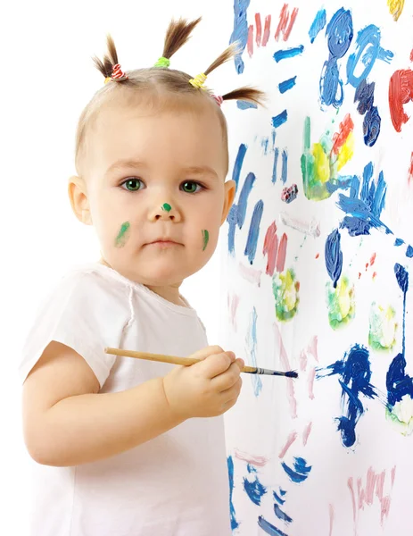 在白板上的小女孩油漆 — 图库照片