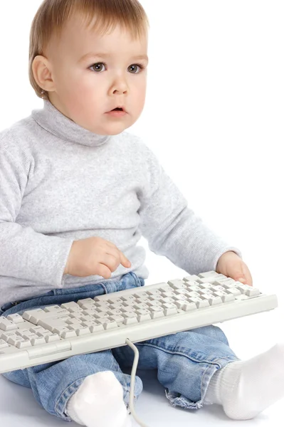 Lindo niño escribiendo en un teclado —  Fotos de Stock