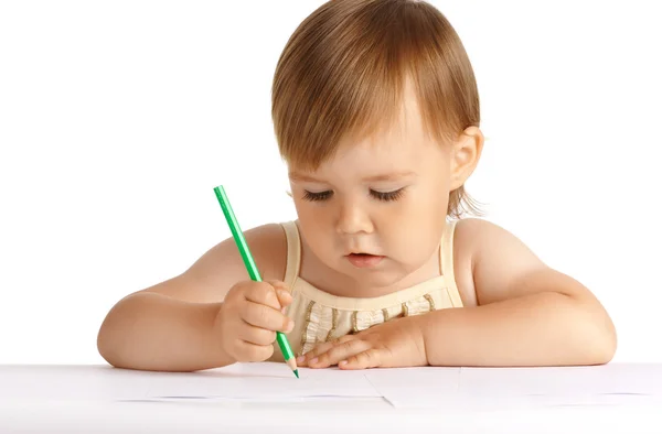 Kind tekenen met groene crayon — Stockfoto