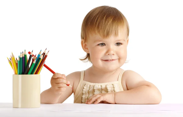 Happy child draw with red crayon — Stock Photo, Image