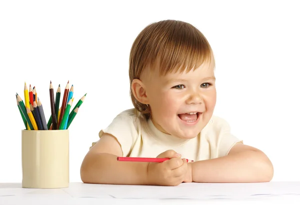 Dítě kreslit červenou pastelkou — Stock fotografie