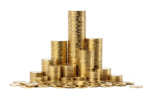 Las pilas de las monedas de oro Imagen de stock
