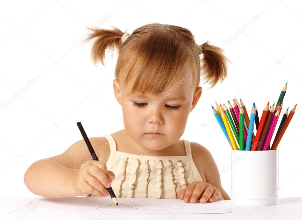Cute preschooler focused on drawing