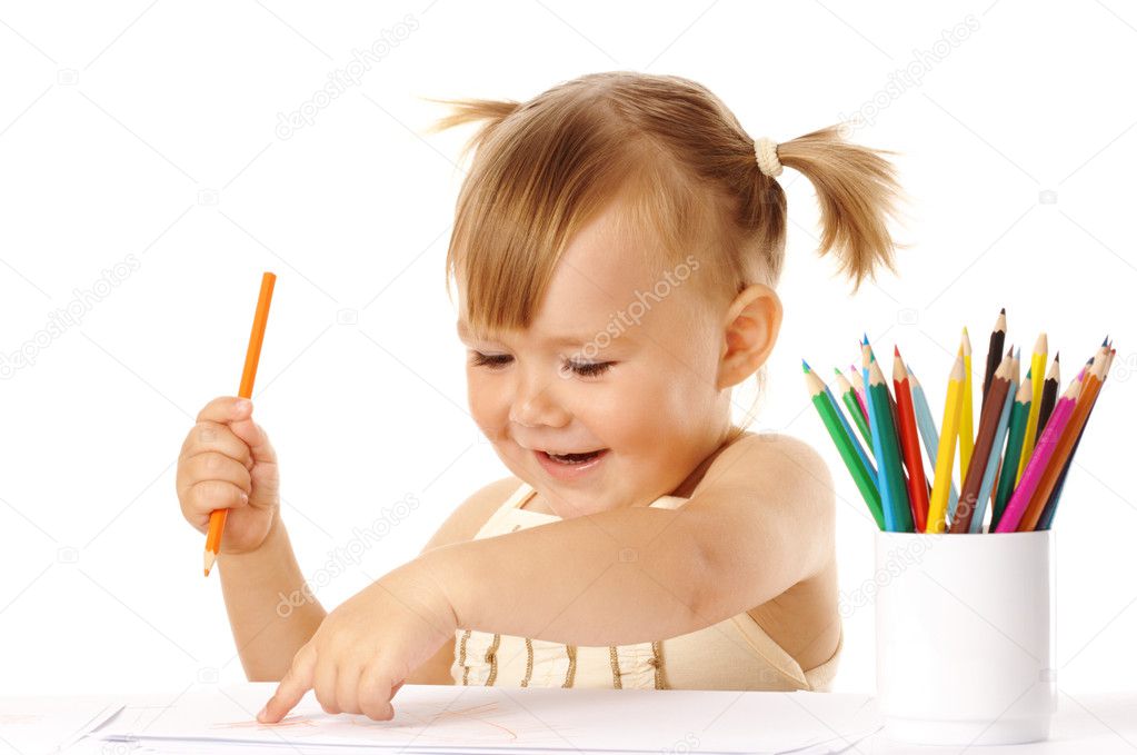 Child points on her drawing and smile