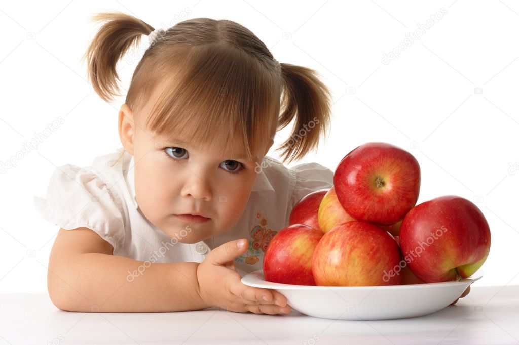 Suspicious child with apples