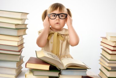 Little girl with books wearing glasses clipart