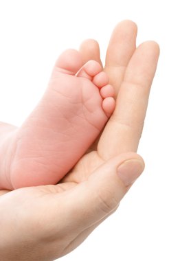 Mother holding her newborn's foot clipart