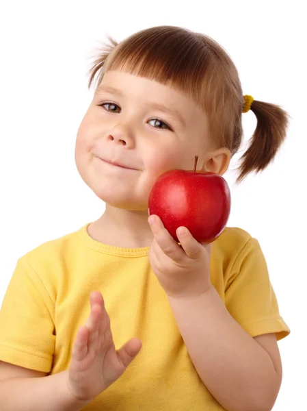 Criança bonito vai morder uma maçã — Fotografia de Stock