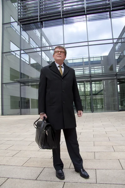 stock image Businessman standing in courtyard