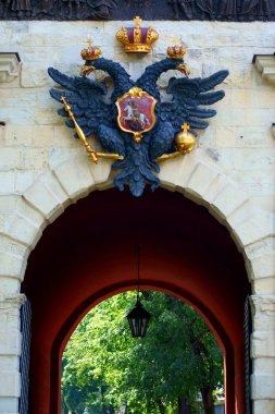 Fortress gates with emblem of Russia above clipart