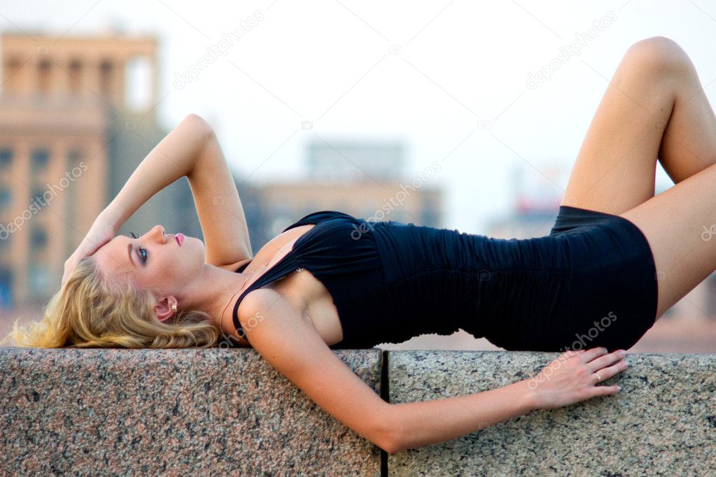 Sexy woman lying outdoors