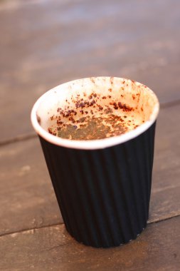 Delicious cappuccino in a take-away cup.