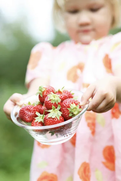 Strawberries held by girl. — Stock Photo, Image