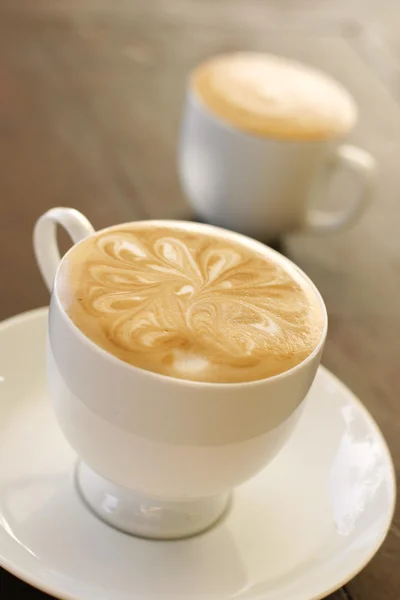 Delicious latte with coffee art design.