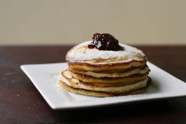 Stack of pancakes with honey and jam. — Stock Photo, Image