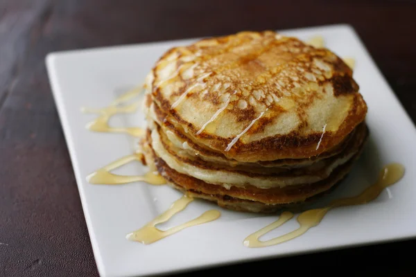 Stack of pancakes with honey. — Stock Photo, Image