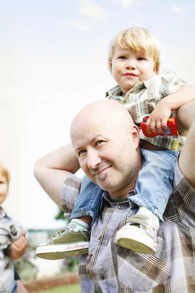 Happy father and two sons outdoors. — Stock Photo, Image