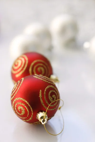 Red and silver colored Christmas baubles — Stok fotoğraf