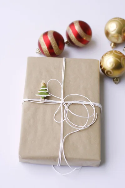 Simply wrapped Christmas gift. — Stock Photo, Image