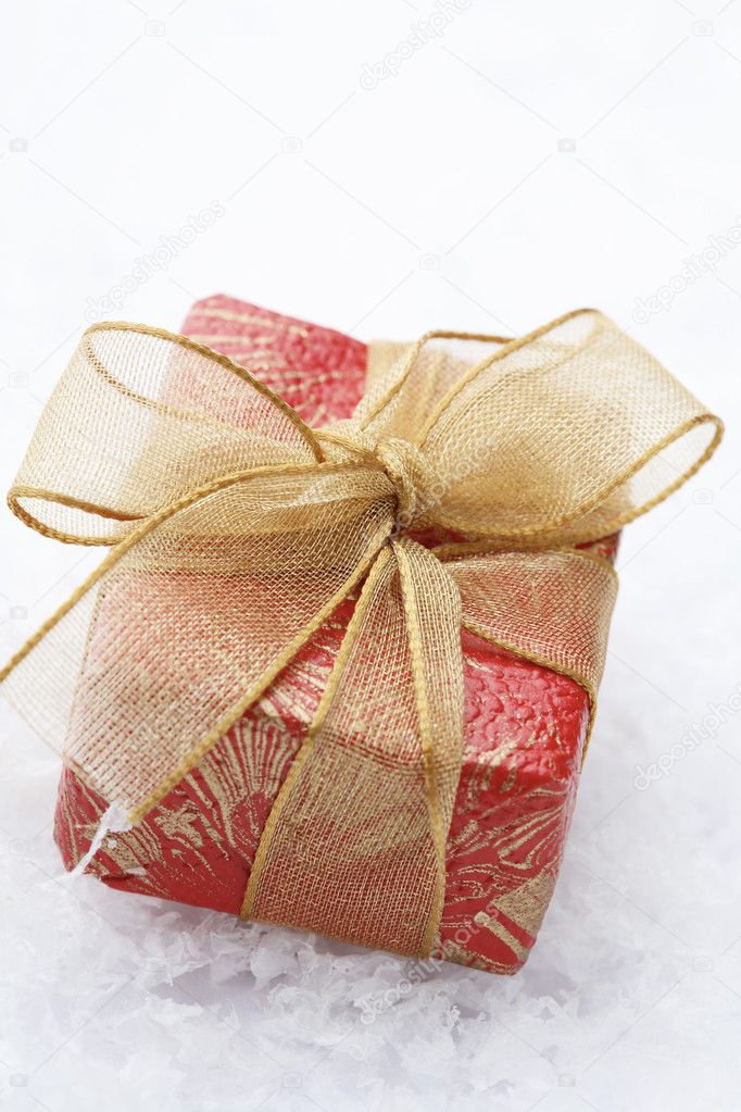 Christmas gift with red wrapping and dec
