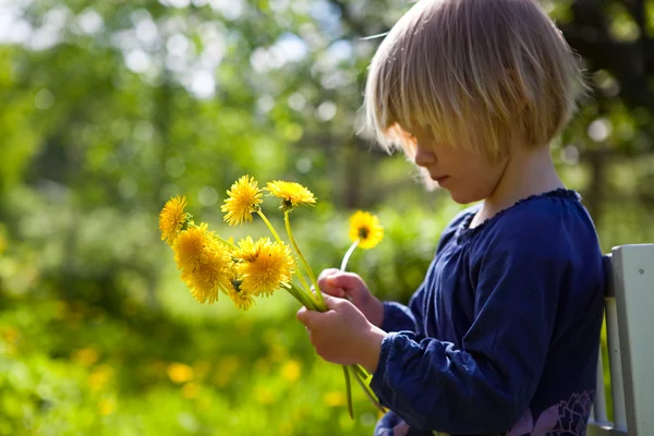 Little girl with dandelions — Stock Photo, Image
