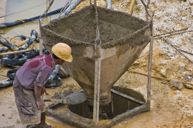 Construction worker assisting pourer (2) clipart