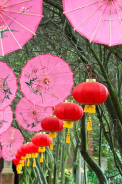 Pink umbrellas and chinese lanterns (1) clipart