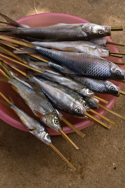 Barbecued fish on stick — Stock Photo, Image