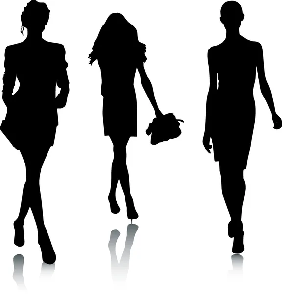Silhouettes of fashion girls — Stock Vector