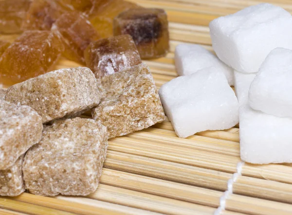 stock image THREE VARIETIES OF SUGAR IN A STRAW NAPK