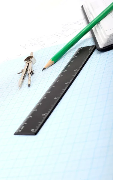A compass on a graph paper — Stock Photo, Image