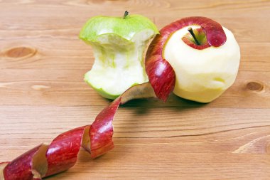 Peeled apples on the table clipart