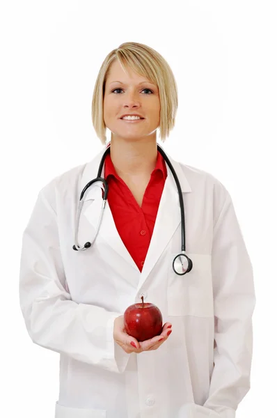 Kadın doktor apple ve stetoskop ile izole — Stok fotoğraf