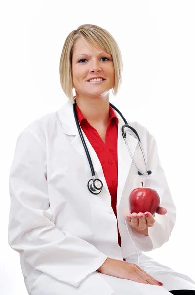 Médica com Apple e Estetoscópio Isolado — Fotografia de Stock