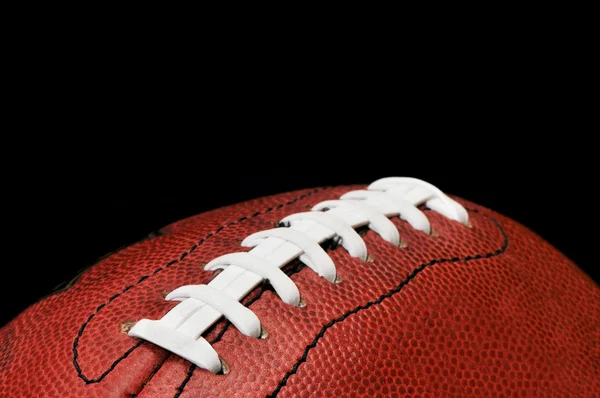 黒に分離されたフットボールのクローズ アップ — ストック写真
