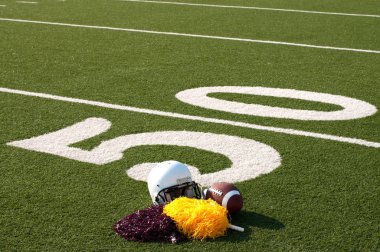 American Football Equipment and Pom Poms on Field clipart