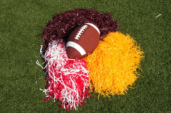 American Football and Pom Poms on Field — Stock Photo, Image