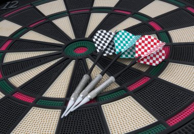 Three arrows on a darts board clipart